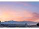 Stunning sunset view overlooking city lights and mountain range at 16 Via Stefano, Henderson, NV 89011