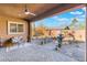 Covered patio with brick flooring and a water fountain at 16 Via Stefano, Henderson, NV 89011