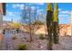 Landscaped backyard with a rock pathway and small fountain at 16 Via Stefano, Henderson, NV 89011