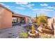 Landscaped backyard with fountain and stone pathway at 16 Via Stefano, Henderson, NV 89011