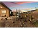 Landscaped backyard with fountain at sunset at 16 Via Stefano, Henderson, NV 89011