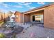 Backyard with patio, fountain, and gravel landscaping at 16 Via Stefano, Henderson, NV 89011