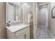 Guest bathroom with single vanity and view of hallway at 16 Via Stefano, Henderson, NV 89011