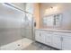 Clean bathroom with a walk-in shower and white vanity at 16 Via Stefano, Henderson, NV 89011