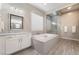 Bathroom boasts a large soaking tub and walk-in shower at 16 Via Stefano, Henderson, NV 89011