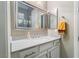 Well-lit bathroom with single vanity and large mirror at 16 Via Stefano, Henderson, NV 89011