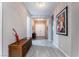 Bright and spacious entryway with tile flooring and modern chandelier at 16 Via Stefano, Henderson, NV 89011