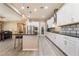 Modern kitchen with stainless steel appliances and white cabinets at 16 Via Stefano, Henderson, NV 89011