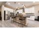 Modern kitchen with stainless steel appliances and large island at 16 Via Stefano, Henderson, NV 89011