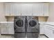 Laundry room with LG washer and dryer, and ample storage at 16 Via Stefano, Henderson, NV 89011