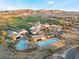 Resort-style pool and clubhouse with palm trees at 16 Via Stefano, Henderson, NV 89011