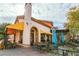 Charming cafe with outdoor seating and yellow awning at 16 Via Stefano, Henderson, NV 89011