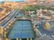 Tennis courts with players visible near the clubhouse at 16 Via Stefano, Henderson, NV 89011