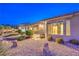 Backyard view featuring low maintenance landscaping, decorative rock features, and covered patio at 1964 Oliver Springs St, Henderson, NV 89052