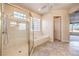 Well-lit bathroom showcasing a glass-enclosed shower and a relaxing soaking tub at 1964 Oliver Springs St, Henderson, NV 89052