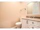 Bathroom features granite vanity, framed mirror, and a toilet at 1964 Oliver Springs St, Henderson, NV 89052