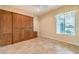 Bedroom with built-in storage, natural light, and tile flooring at 1964 Oliver Springs St, Henderson, NV 89052