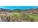 Scenic view of the lush golf course, surrounded by desert landscape and mountains in the distance at 1964 Oliver Springs St, Henderson, NV 89052