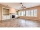 Spacious living room features a fireplace, custom built-ins and plantation shutters for a bright and airy feel at 1964 Oliver Springs St, Henderson, NV 89052