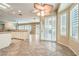 Bright living room with decorative ceiling fan, patio access and tile flooring at 1964 Oliver Springs St, Henderson, NV 89052