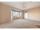 Bright living room with a large bay window offering scenic views and a ceiling fan at 1964 Oliver Springs St, Henderson, NV 89052