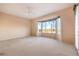 Main bedroom features carpet, bright windows, and a balcony at 1964 Oliver Springs St, Henderson, NV 89052