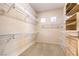 Organized walk-in closet with shelving, built-in drawers, and carpeted floor at 1964 Oliver Springs St, Henderson, NV 89052