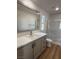 Modern bathroom with vanity, large mirror, and walk-in shower at 2028 College Pl, Las Vegas, NV 89156