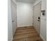 Bright entryway with wood-look flooring and coat closet at 2028 College Pl, Las Vegas, NV 89156