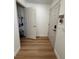 Bright entryway with wood-look flooring and coat closet at 2028 College Pl, Las Vegas, NV 89156