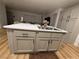 Kitchen island with double sink and white cabinets at 2028 College Pl, Las Vegas, NV 89156