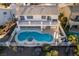 Aerial view of house with pool and spa; located on a golf course at 2412 Eagleridge Dr, Henderson, NV 89074