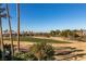 View of backyard, featuring a green golf course and city skyline at 2412 Eagleridge Dr, Henderson, NV 89074