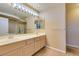 Double vanity bathroom with mirror and flooring at 2412 Eagleridge Dr, Henderson, NV 89074