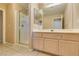 Bathroom with shower and light wood cabinets at 2412 Eagleridge Dr, Henderson, NV 89074