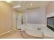 Bathroom with shower, corner tub and fireplace at 2412 Eagleridge Dr, Henderson, NV 89074