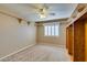 Bedroom with ceiling fan, built-in shelving and window at 2412 Eagleridge Dr, Henderson, NV 89074