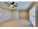 Spacious bedroom with ceiling fan and carpet flooring at 2412 Eagleridge Dr, Henderson, NV 89074