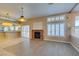 Gathering room with a brick fireplace and adjacent kitchen at 2412 Eagleridge Dr, Henderson, NV 89074