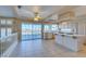 Kitchen with island, white cabinets, and views of the pool at 2412 Eagleridge Dr, Henderson, NV 89074