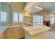 Wet bar with cabinets and sink, perfect for entertaining at 2412 Eagleridge Dr, Henderson, NV 89074