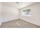 Bright bedroom featuring neutral carpeting and large window at 2500 W Oakey Blvd, Las Vegas, NV 89102