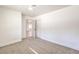 Well-lit bedroom with door to hallway and plush carpeting at 2500 W Oakey Blvd, Las Vegas, NV 89102