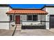 Front entrance of a remodeled home with red door and tile roof at 2500 W Oakey Blvd, Las Vegas, NV 89102