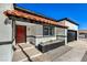 House exterior with red door, tile roof, and landscaping at 2500 W Oakey Blvd, Las Vegas, NV 89102