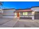 Newly renovated home with a modern exterior and walkway at 2500 W Oakey Blvd, Las Vegas, NV 89102