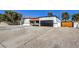 Front of house with large driveway and wood fence at 2500 W Oakey Blvd, Las Vegas, NV 89102