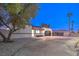 Newly renovated home with a modern exterior and curved driveway at 2500 W Oakey Blvd, Las Vegas, NV 89102