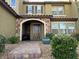 Two-story home with stone accents and a welcoming front porch at 3029 Camino Sereno Ave, Henderson, NV 89044