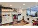 Modern kitchen with white cabinets, stainless steel appliances, and wood flooring at 3143 Sonata Dr, Las Vegas, NV 89121